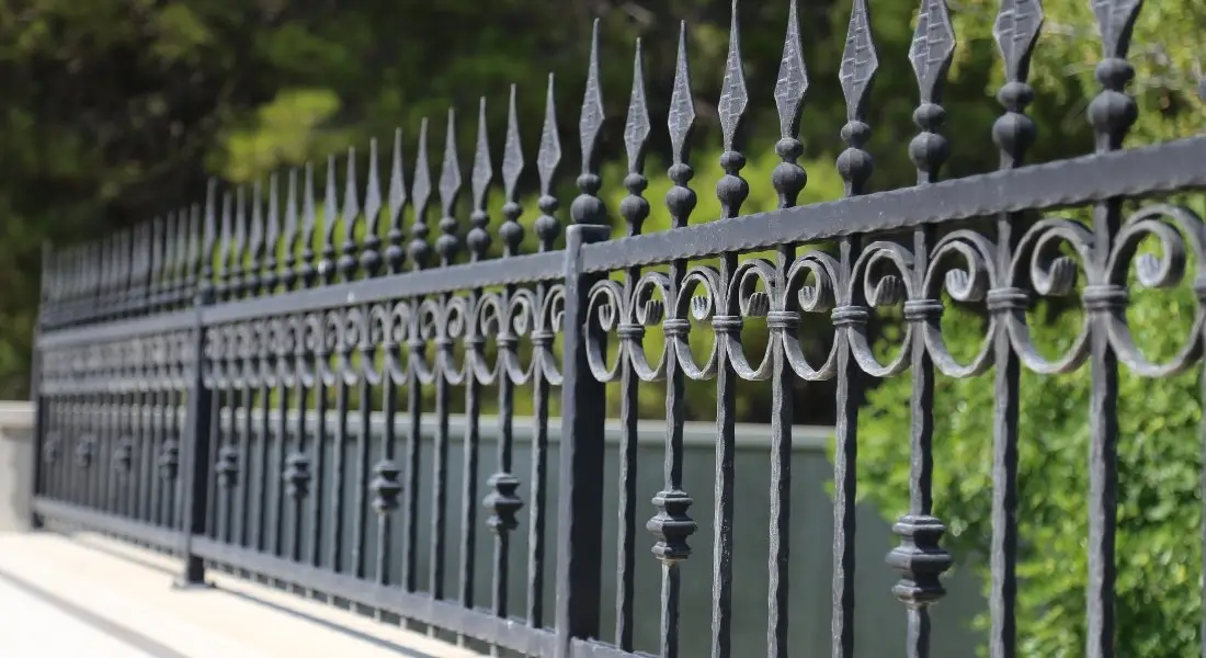 decorative black wrought iron fence with pointed tops