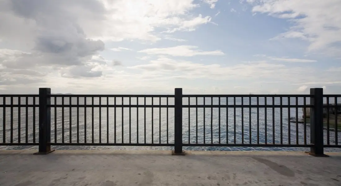 metal railing fence overlooking the water