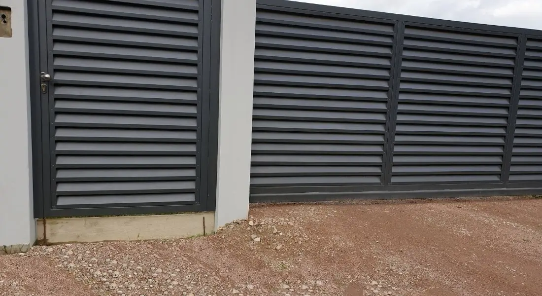 modern horizontal metal panel fence with matching gate