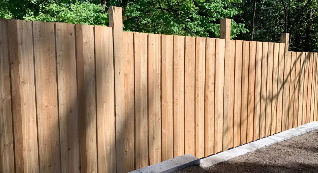tall vertical wooden privacy fence