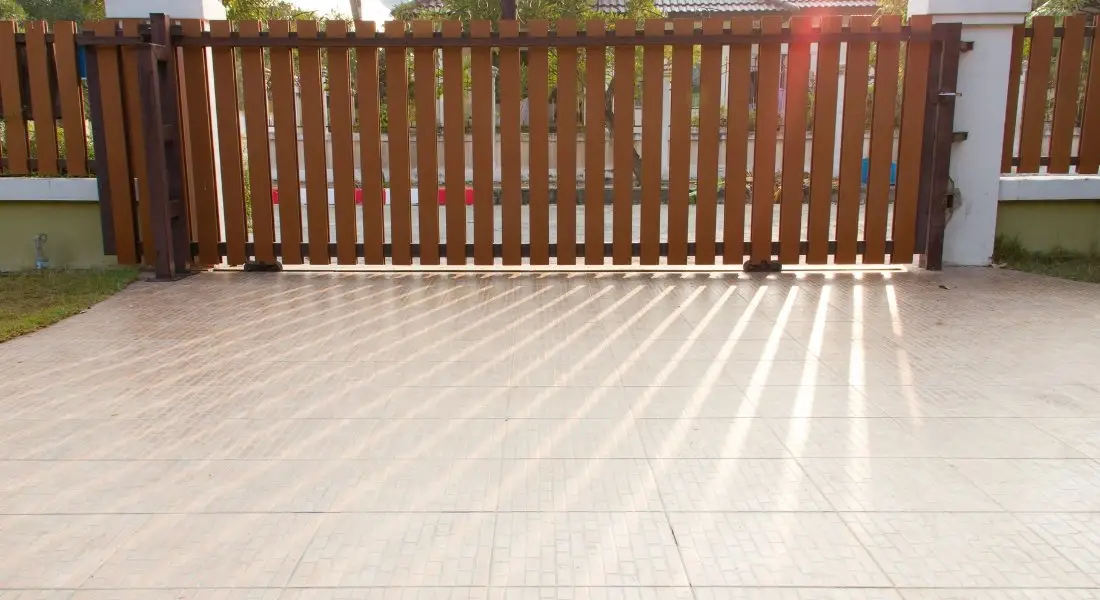wooden driveway gate with vertical slats